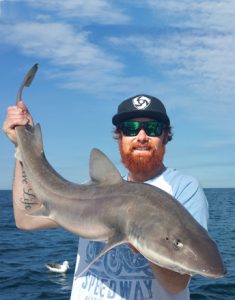 Aaron Habgood with one of his gummy shark.