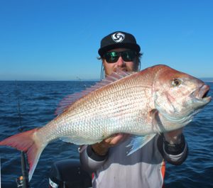 Aaron Habgood with one of the snapper he caught offshore from Port Phillip Heads last week.