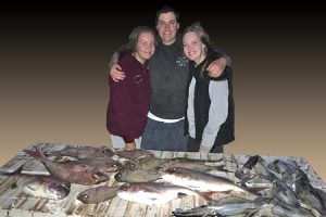 Tony Hargreaves with nieces Jamee and Jemma Beyer, and their excellent catch off Clifton Springs.