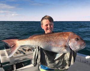 Lachie Stephens 12, with the 8.5 kg snapper he caught off Clifton Springs on Sunday afternoon (Picture: Nick Stephens).