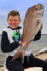 Good Start: Nine year old Billy Smart with the snapper he caught from Corio Bay over the weekend.