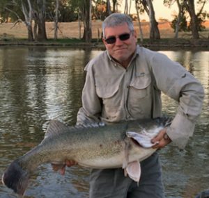 Neil Brown with an eleven kilogram cod from the same trip (Picture: John Clements).