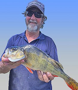 Basil Wentworth with a 1.3 kg redfin from Lake Purrumbete (Picture John Clements).   