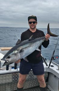 Sam Donaldson with one of the tuna he caught east of Portland last week (Picture: Jake Donaldson).