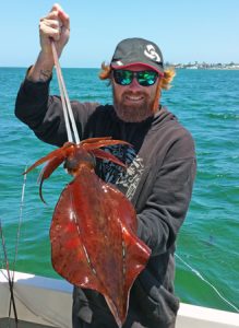 Aaron Habgood with one of the squid he caught off Queenscliff at the weekend (Picture: Aaron Habgood).