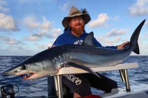 Paul Carson with the mako shark that was taken at night 70 km offshore from Warrnambool (Picture: Kevin McLoughlin).