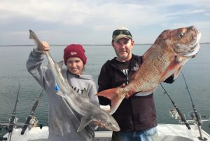 Saturday double: Thirteen year old Brooklyn Erard and father Col Erard with the gummy shark and snapper they caught offshore from the Mountain View Quarries on Saturday (Picture: Malcolm Erard).