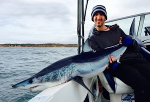 Jeremy McLoughlin with the Mako shark he caught last week (Picture: Kevin McLoughlin).