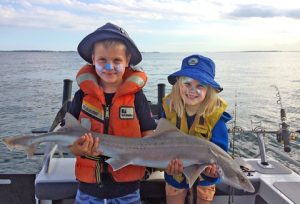 Henry and Sophia Jankowski with the gummy shark they caught near the West Channel (Picture: Warren Jankowski).