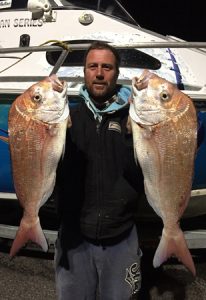 Matt Kincaid with two of the four snapper that he and Danny Skene caught off Point Richards in Port Phillip Bay on Thursday night (Picture: Danny Skene).