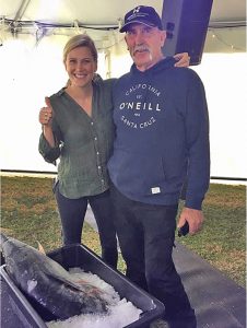 Portland angler, Bob McPherson, of gets some hands-on instruction from Master Chief star Justine Schofield on preparing the catch.   