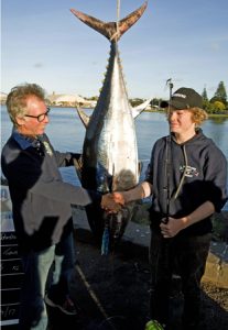 Legendary lure maker, Peter Pakula, congratulates fifteen year old Hugh Johnstone on the capture of a 60 kg bluefin on a Pakula lure at Portland (Picture Bob McPherson).   