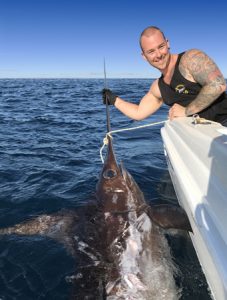 Gladiator: Brian Nolan with the broadbill swordfish he and his companions caught from Bass Strait last week (Picture: Kevin McLoughlin).