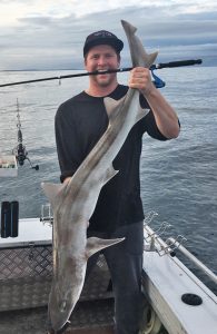 Sam Donaldson with a whiskered gummy shark that he caught at Kangaroo Island last week (Picture: Jake Donaldson).   