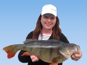 Natalie Holmes with the 2.58 kg redfin she caught from ... Well husband Trevor won’t let her say, so your guess is as good as mine (Picture: Victorian Inland Charters).