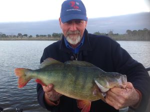 Chris Rigg with a 2 kg redfin from Lake Toolondo (Picture: Victorian Inland Charters).