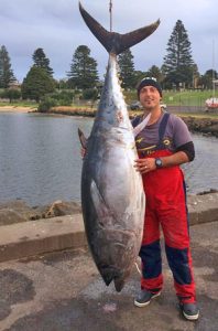 Emro Abazovic with the 120 kg tuna he and his crew caught close in off Cape Bridgewater (Picture: Bob McPherson). 