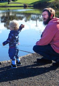 Learning the trade: Michael Redpath with his 18 month old grandson Jaxon, fishing for carp in Seagull Paddock, North Geelong (Picture: Liffy Jennings). 