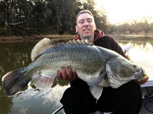 Justin Burns with his 95 cm Murray cod from the Murray River near Echuca. (Picture: Simon Williams).