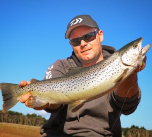 Spoon fed: Michael Evans with a 62 cm brown trout that he caught on a spoon at Wurdiboluc Reservoir last week (Picture: Michael Evans).