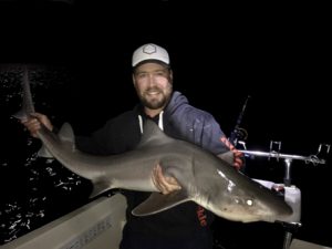 Marcus Pearson with a gummy shark he caught off Torquay.