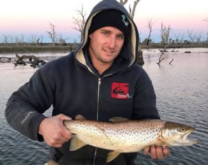 Shaun McDonald with his brown trout from Lake Toolondo (Picture: Victorian Inland Charters).