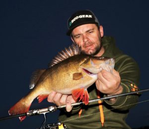 Michael Evans with a sample of his redfin catch from Wurdiboluc Reservoir on Sunday night (Picture Michael Evans).