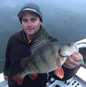 Michael Evans with a nice redfin taken on a Fish Arrow Soft Plastic (Picture: Victorian Inland Charters).