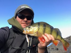 Michael Evans with a redfin that he caught from Wurdiboluc Reservoir on Sunday (Picture: Michael Evans).