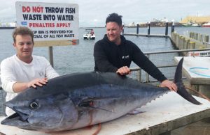 Steve Prior and Jacob Mills with the 118 kg tuna they caught off Port MacDonnell on Saturday (Picture: Bob McPherson).   