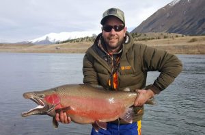 New Zealand fishing guide Graham Eldridge  with a 12.9 kg rainbow from the Twizel Canals. 