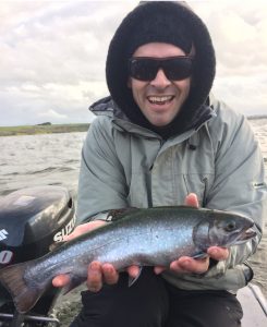 Jason Kelly with his 1.5 kg brook trout from Lake Purrumbete (Picture: John Clements).