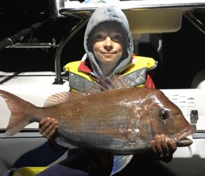 Cody Formosa with one of the snapper that he and his father John caught offshore from Point Wilson over the weekend.