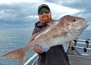 Big Red: Aaron Habgood with yet another big snapper from Corio Bay (Picture: Aaron Habgood).