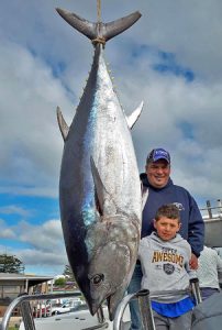 Kevin Agius and his son Korey with the 118 kg tuna they caught offshore from Portland.   