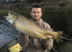 Paul Rahman with the 4.6 kg brown trout he caught from Lake Purrumbete on Saturday evening (Picture Paul Kovzan). 