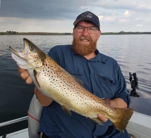 Damian Coter with a 5 kg brown trout from Lake Purrumbete (Picture: Lake Purrumbete Holiday Park).