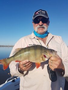 Former test cricket star Merv Hughes with a redfin from Lake Wartook (Picture: Victorian Inland Charters).   