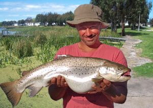 Phillip Pirotta with his 4.8 kg brown trout (Picture: Lake Purrumbete Holiday Park).   