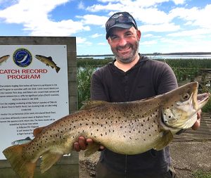 Tim Beusmans with yet another trophy size brown trout that he caught from Lake Purrumbete on Saturday.