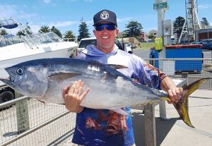 Summertime blues: Dale Cannon with a 34 kg bluefin tuna; one of several that he caught offshore from Portland last week (Picture: Bob McPherson).