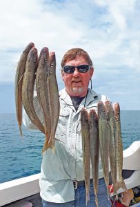 Lachie Wombell with a sample of the whiting he and his companions caught off Portland last week. (Picture: Bob McPherson).