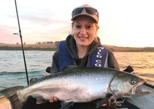 Amanda Richards with a good size chinook salmon that she caught from Lake Bullen Merri (Picture courtesy of Lake Purrumbete Holiday Park).