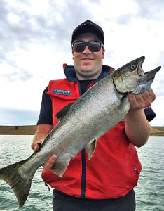 Steven Hill with a 4 kg chinook salmon from Lake Bullen Merri (Picture courtesy of Lake Purrumbete Holiday Park).