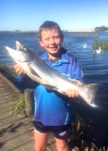 Sammy Giles of Bannockburn with a chinook salmon of 2.4 kg (Picture: Courtesy Lake Purrumbete Holiday Park).   