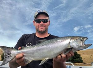 Michael Evans of Victorian Inland Charters shows one of the several chinook salmon that he and his clients caught from Lake Bullen Merri over the weekend.