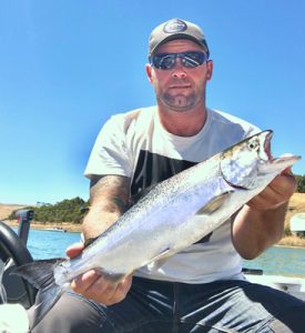 Michael Evans of “Victorian Inland Charters (South West)” with a chinook salmon from Lake Bullen Merri.