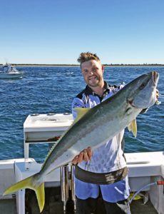 Alex Thompson with his 10.5 kg kingfish from Port Phillip Heads on Sunday (Picture Ben King).