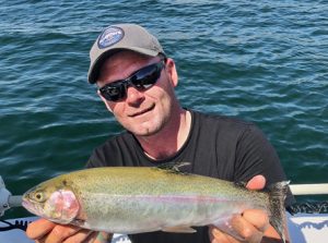 Michael Evans with a rainbow trout from Lake Purrumbete (Picture: Victorian Inland Charters, South West). 