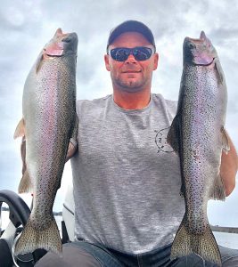 Michael Evans with two rainbow trout from Lake Purrumbete (Picture: Victorian Inland Charters, South West).